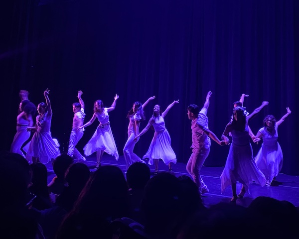 Pairs of dancers in white attire. 